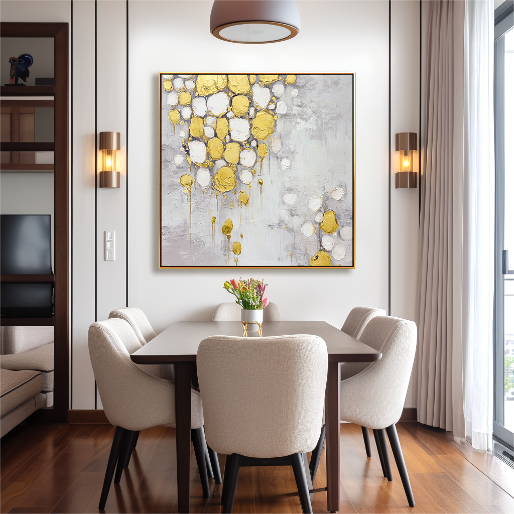 Abstract painting with gold and white textured drops on a soft gray background