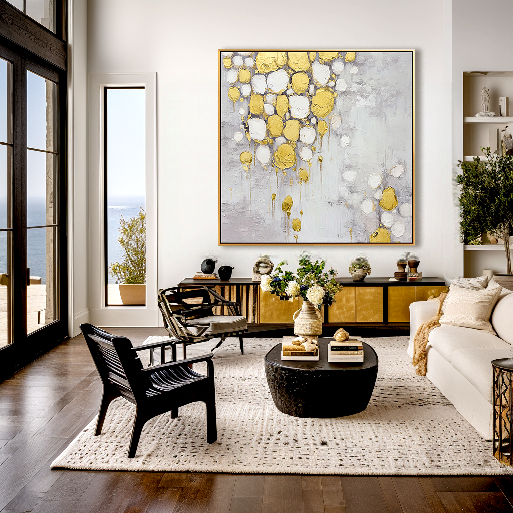 Abstract painting with gold and white textured drops on a soft gray background